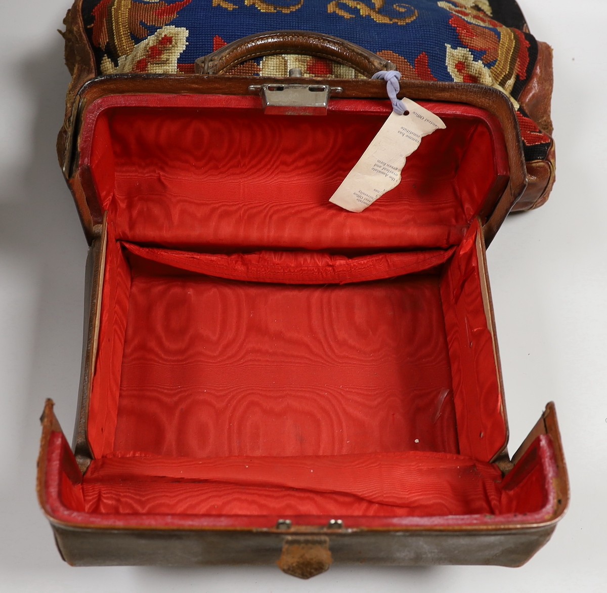 A 19th century needlework and leather bag and a leather Gladstone bag, needlework bag frame 40cms wide